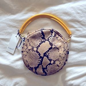 Clare V round snake print bag.